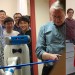 Dean Ned Thomas cutting the ribbon for the new robotics lab